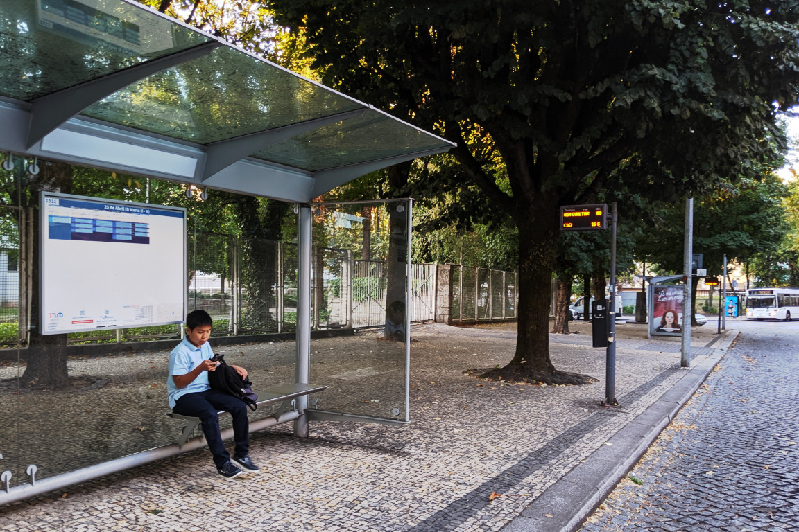 William waits for Route 24 to Gualtar at the bus stop D Maria II-II on 25 de Abril